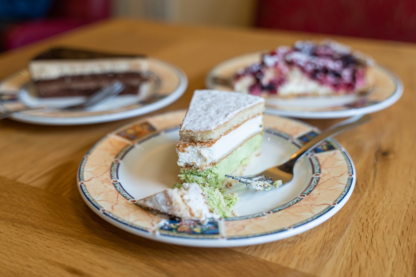 A slice of pistachio cake and Italian desserts at CaffeLatte